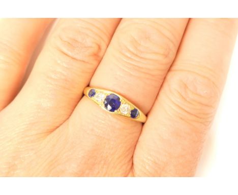 Diamond and sapphire five stone ring, in 18ct yellow gold, the central sapphire flanked by smaller brilliants with two outer 