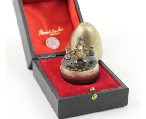 Stuart Devlin silver gilt surprise egg, London 1980, brushed satin finish, the exterior opening to reveal a ram seated holdin