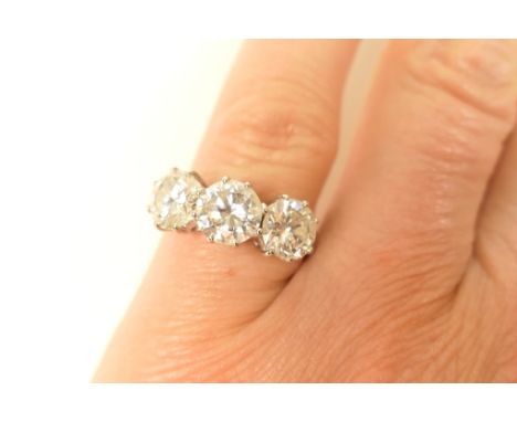 Good diamond three stone ring, the central stone estimated as approx. 1ct, G/H in colour, SI1 clarity, and the two outer ston
