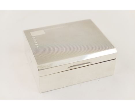 Walker & Hall silver cigarette box, Sheffield 1954, engine turned decoration and a vacant cartouche, cedarwood interior, 11cm