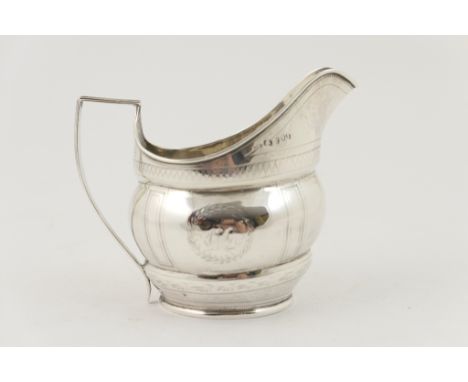 George III silver milk jug, by Thomas Watson, circa 1805-15, helmet shaped with wrigglework decoration, monogrammed cartouche
