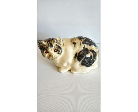 Ceramic cat figurine, signed Winstanley, with a cream and black marbled finish.