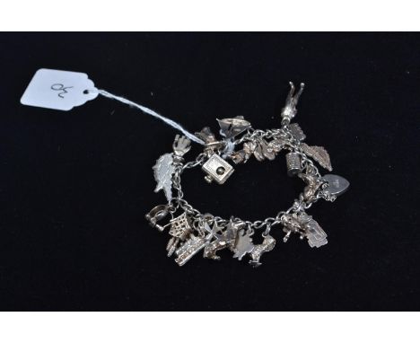 Heavy silver charm bracelet, gross weight 50.4g 