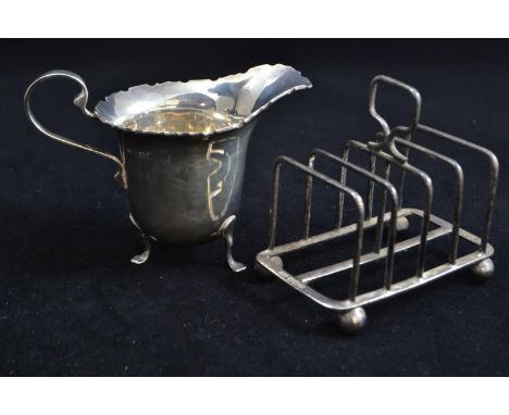 Silver cream jug, maker A Bros LTD, Birmingham 1922, together with a silver toast rack, maker HA, Sheffield 1922, 9.5cm lengt