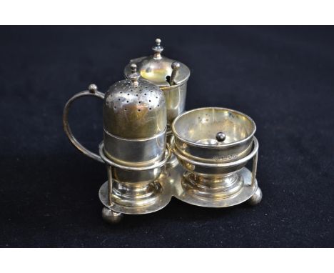 Silver cruet set, maker H.W & Co Ld, London 1912, 15 & 16, comprising trefoil stand with pepperette, salt, mustard & two spoo