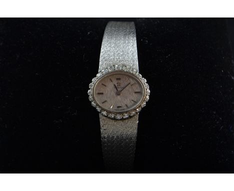 Omega ladies 18ct white gold & diamond-set wristwatch, with manual winding movement, 17 jewels, oval-shaped case with diamond