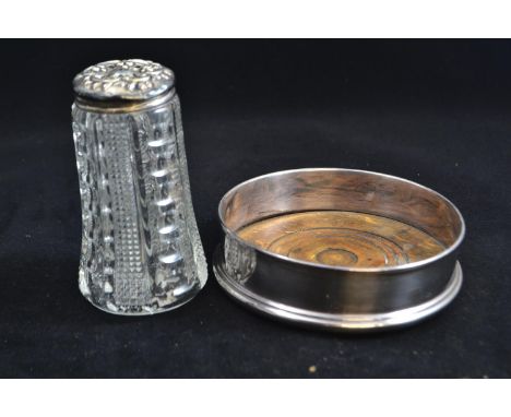 Silver wine coaster, maker R & D, London 1969, together with a silver lidded sifter, maker JCP & Co, Chester 