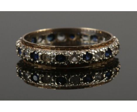 A 9ct gold sapphire and cubic zirconia ring. Size T. 3.14g.  