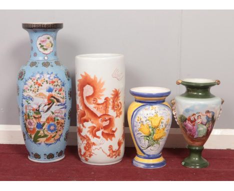A group of four large ceramic vases. various sizes.  