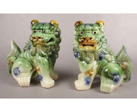 A pair of ceramic Chinese temple lions/ dogs of Fu. 32.5cm h.  