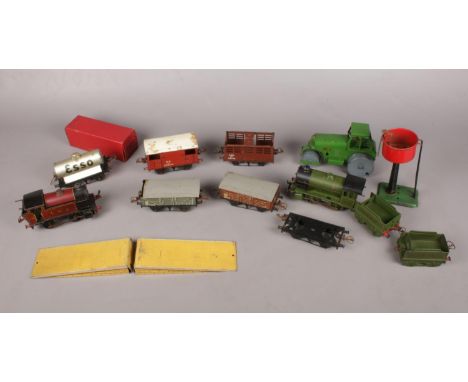 A quantity of Hornby O Gauge by Meccano train set, together with a Tri-Ang Minic Steam roller. To include a large quantity of
