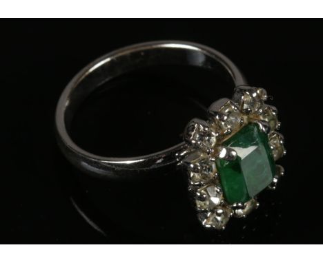 A 1950's Christian Dior Dress Ring, with Faux Emerald surrounded by Diamond Paste.  