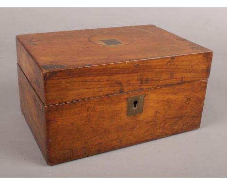 A Victorian mahogany tea caddy.  