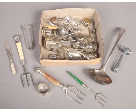 A quantity of flatware. Including a bread fork with hallmarked silver mounts.  