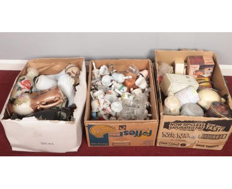 Three boxes of miscellaneous. Vases, ceramic bells, vintage tins.  