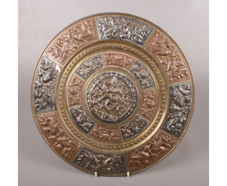 A bronze coloured Indian plaque. With foil overlay decoration. Presented by the Indian Society of Otology. 40cm.  