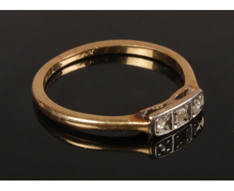 An 18ct Gold Three Stone Set Diamond Ring. Size N. Total Weight: 1.99g  Condition Good, small part of the Bridge missing.