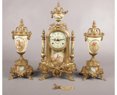 A decorative brass mounted clock garniture, decorated with scenes of courting couples.  