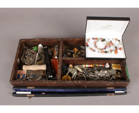 A cutlery tray with an assortment of collectables. To include a boxed conductors baton and enamel badges etc.  