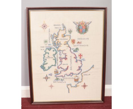A framed sampler style cross stitch of the British Isles. H: 64cm, W:50cm.  