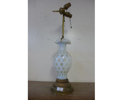 A Victorian style cased vaseline glass table lamp