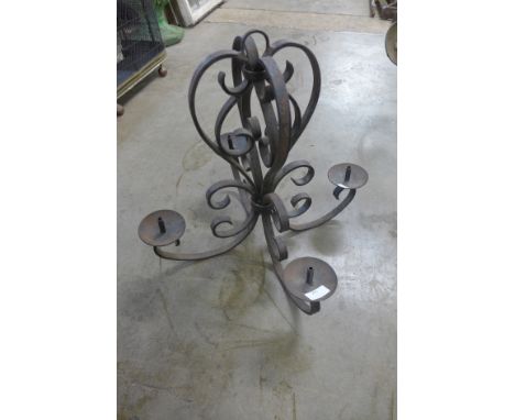 A French wrought iron candle chandelier