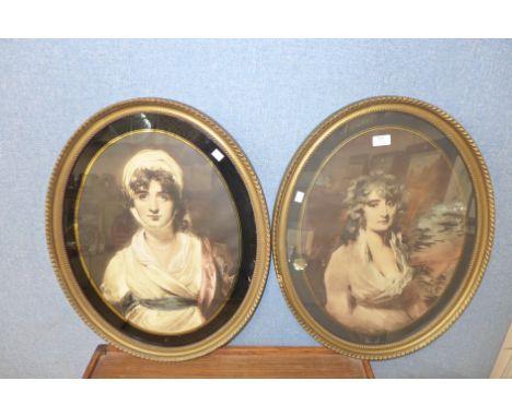 A pair of oval portrait prints of ladies