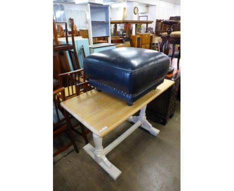 A painted pine refectory table and a blue leather pouffe