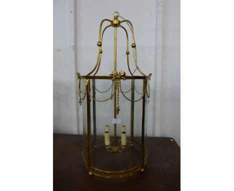 A Neo-Classical style gilt metal cylindrical lantern