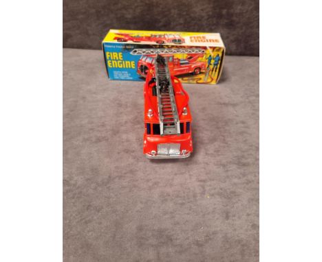 Boxed Vintage plastic Made in Hong Kong Fire Engine, with friction drive and expanding turn table ladder. Made around late 19