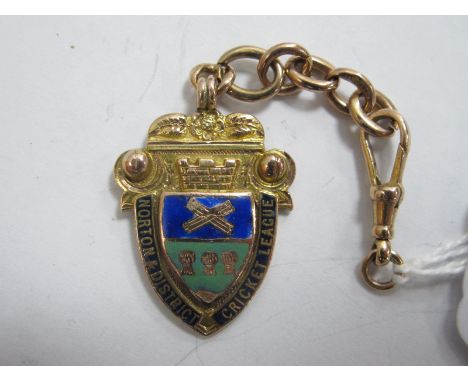 Medal, Norton and District Cricket League, in 9ct gold and enamel, engraved H. Bagnall, 1912.