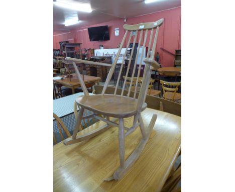 An Ercol Blonde elm and beech Goldsmith rocking chair 