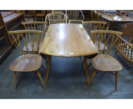 An Ercol Blonde elm and beech Windsor drop-leaf table and four 376 model candlestick back chairs 