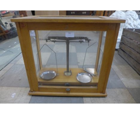 A set of cased chemical balance scales 