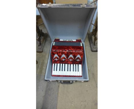 A cased piano accordion 