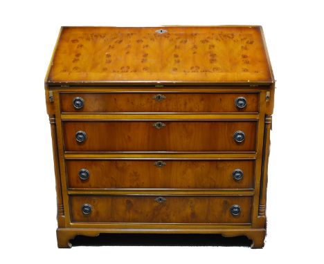 A reproduction yew wood finish bureau, fall front enclosing a fitted interior, fall long drawers under, bracket feet, width 9