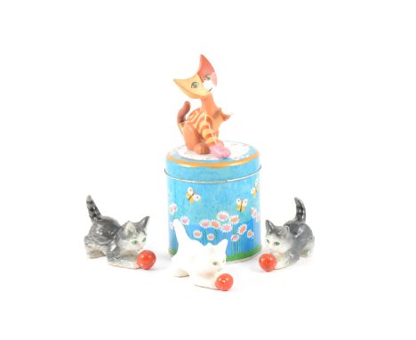 Collection of Goebel cat models including Rosina Watchtmeister and vintage Goebel cats.
