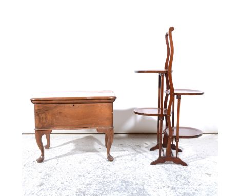 A mahogany double-fold four-tier cake stand, standard ends, 78cm; and a teak wood serpentine-shape sewing table.