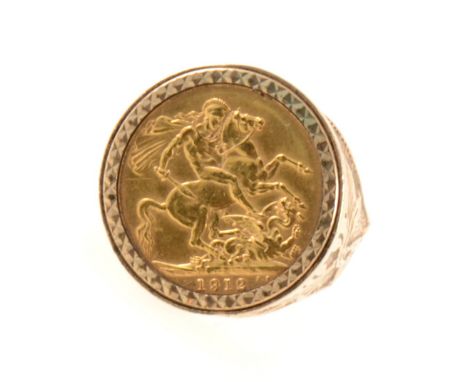 A Full Sovereign ring, George V 1912, set in a 9 carat yellow gold mount with diamond cut bezel and leaf design shoulders, ha