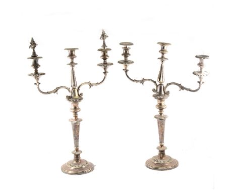 A pair of tall electroplated three-light candelabra, scrolled branches, 60cm excluding floral finials.