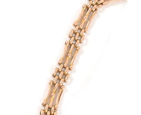 A yellow metal three bar gate link bracelet, 10mm wide, fitted with a swivel fastener marked 9ct, approximate weight 12.3gms.