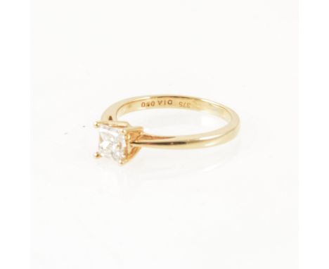 A diamond solitaire ring, the princess cut stone four claw set in a 9 carat yellow gold single stone mount, approximate weigh