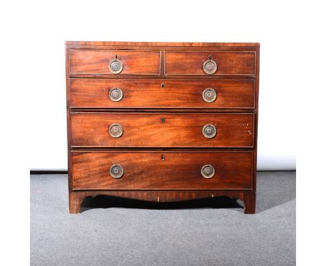 A George III mahogany chest of drawers, the top with cross-banding, fitted with two short and three long drawers, bracket fee