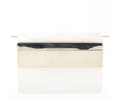 A silver cigarette box by Walker &amp; Hall, wood-lined, slightly domed engine-turned lid, Sheffield 1922, 17.5cm width.