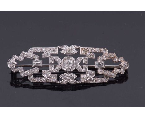 An Art Deco diamond brooch, set to centre with an old European cut diamond with further old cut, single cut and step cut diam