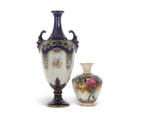 A Royal Worcester vase with mask handles painted with panels of fruit and flowers together with a small Worcester Hadley vase