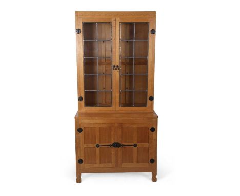 Robert, "Mouseman" Thompson - Light oak bookcase or display cabinet with two lead glazed doors over a base with two four pane