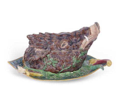 An extremely rare and important Minton Maiolica game tureen and stand, the cover modelled as a boars head in Maiolica glazes 