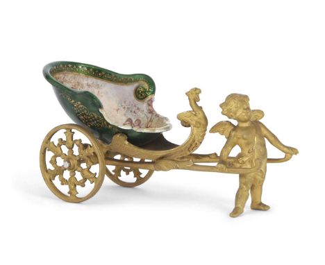 A 19th Century French enamel and ormolu chariot, it shows a standing winged cherub or putto between the arms of a chariot, th