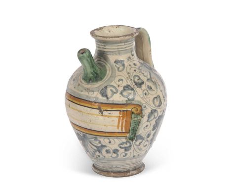 An Italian Maiolica syrup jar with typical blue sponged decoration, vacant title cartouche edged in yellow and ochre with str